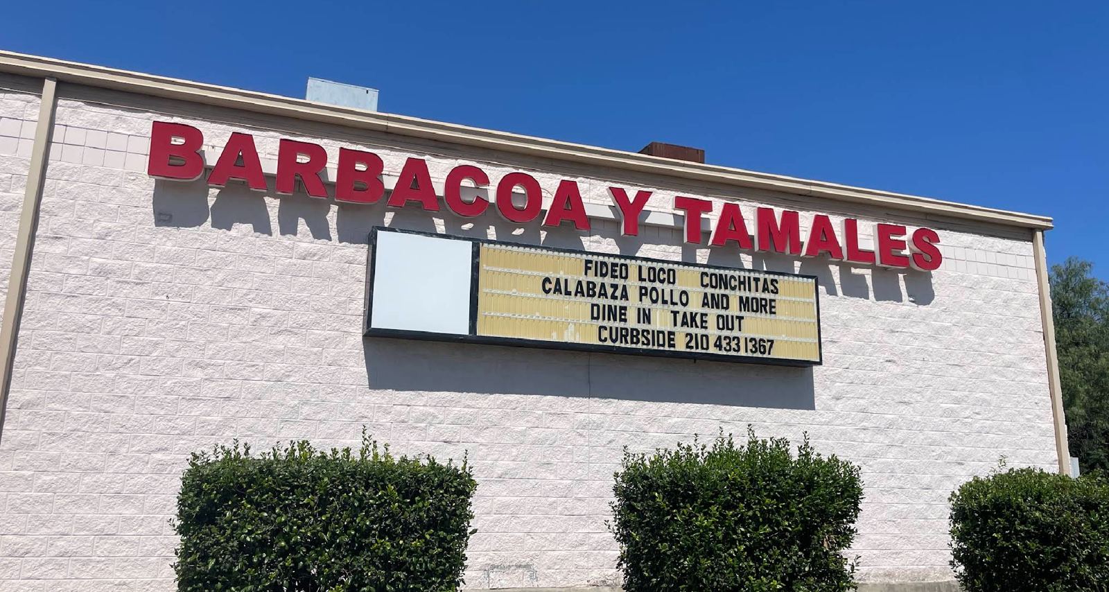 BARBACOA Y TAMALES sign on the Tellez building