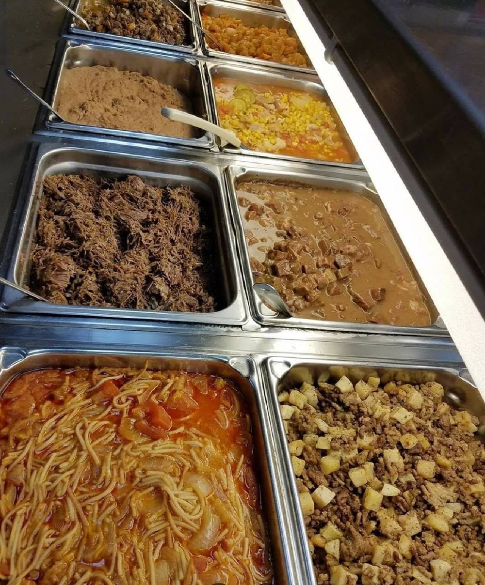 Steam table with barbacoa, beans, fideo and picadillo